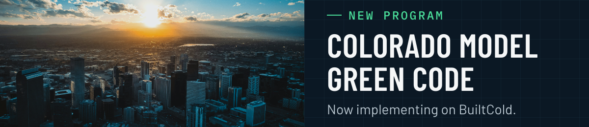 New program: Colorado Model Green Code, now implementing on BuiltCold. Aerial photo of the Denver skyline at sunset with the Front Range behind it.